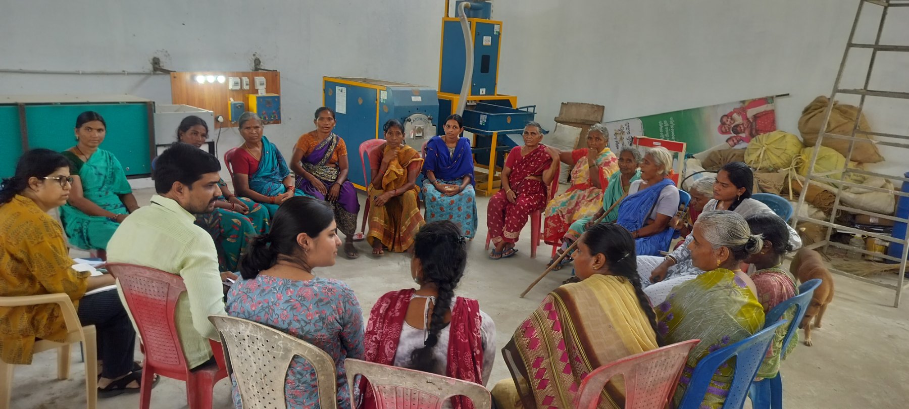 Field research session — a focus-group discussion with smallholder farmers seated in a circle